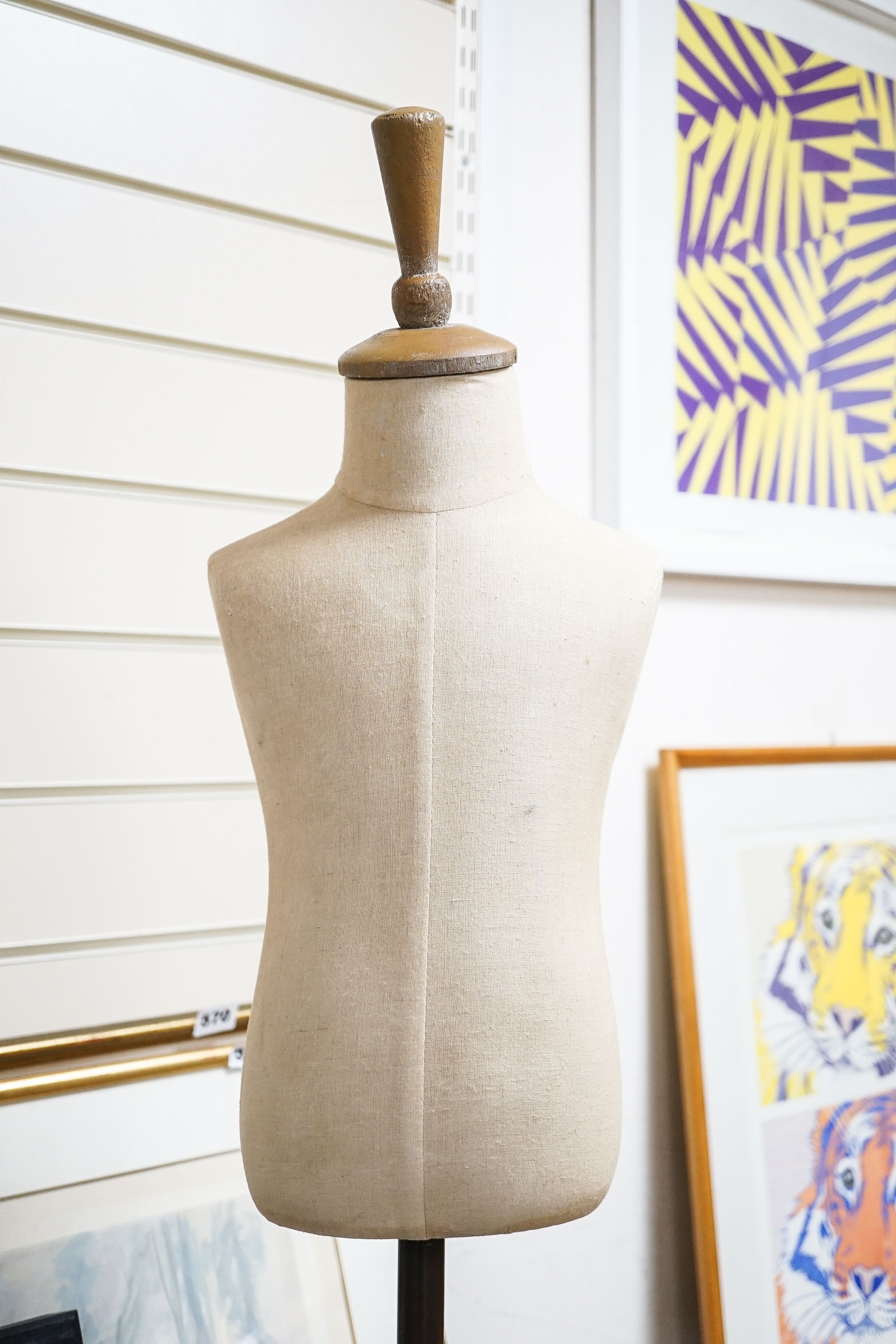 A mannequin on cast iron stand, height 103cm, and a retailer's Thorne's Toffee can
